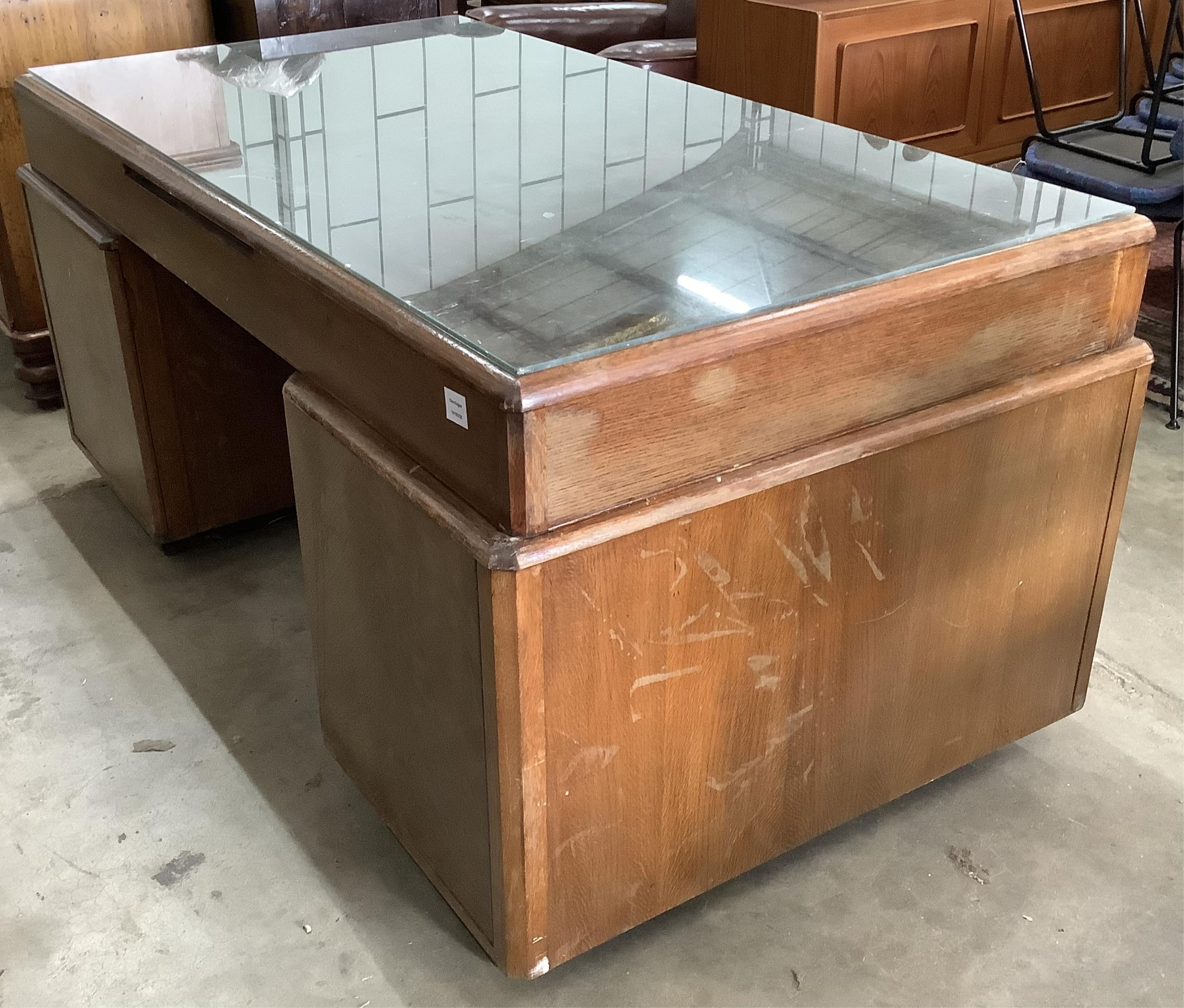 An early 20th century Continental oak pedestal desk, width 165cm, depth 94cm, height 78cm